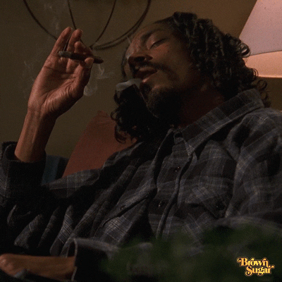 Snoop Dogg Who Is Smoking While Eyes Close GIF