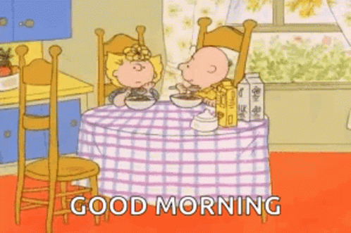 Snoopy and Charlie Brown Sitting at Table