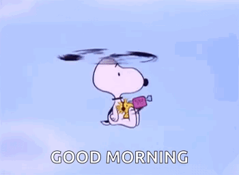 Snoopy Is Flying Through The Air While Holding A Candy And A Flower . GIF