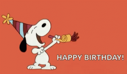 Snoopy Is Wearing A Party Hat And Blowing A Party Horn And Saying Happy Birthday . GIF