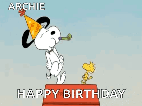 Snoopy Is Wearing A Party Hat And Blowing A Party Horn While Woodstock Is Standing On A Box . GIF