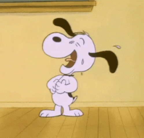 Snoopy Laughing on Wooden Floor Near Chalkboard