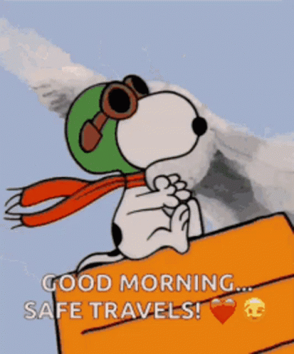 Snoopy Wearing Helmet and Goggles Sitting on Sign