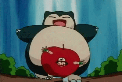 Snorlax From Pokemon Is Holding A Red Apple With Ash In It . GIF
