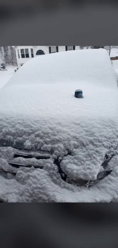 Snow Covered Car in Front of House