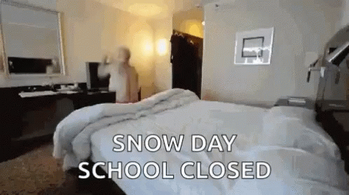 Shirtless Man Jumping On Bed Enjoying Snow Day GIF