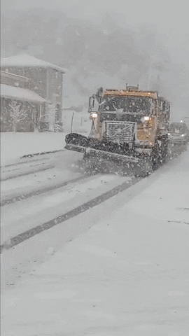 Snow Removal Vehicle Clearing Road Amid Bomb Cyclone GIF