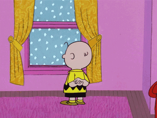 Sad Charlie Brown Watching Snow Storm GIF