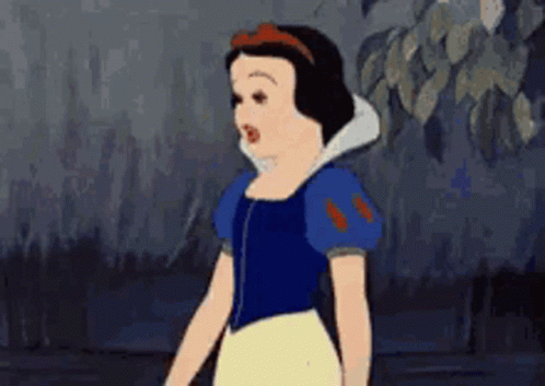Snow White From Disney 'S Snow White And The Seven Dwarfs Is Standing In A Dark Forest . GIF