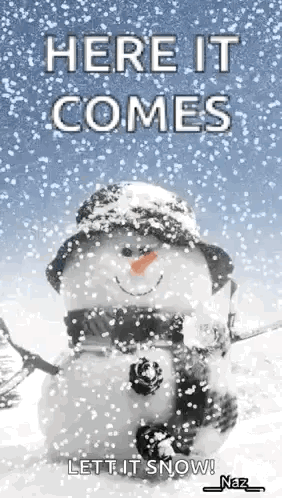 Snowman in Hat and Scarf Saying Here It Comes Let It Snow