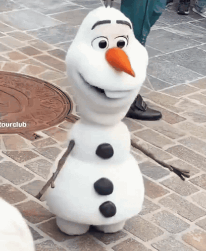 Snowman with Carrot Nose in Front of Tourclub Logo