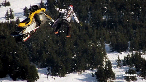 Snowmobile And Man Falling To The Ground GIF