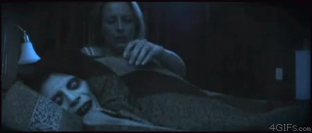 Snuggling Scary Face In Bed GIF