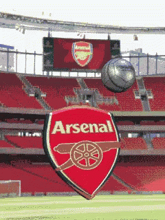 Soccer Ball Flying in Front of Arsenal Logo