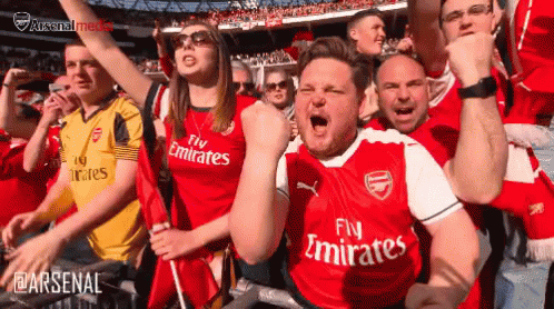 Soccer Fans Cheering in Fly Emirates Jerseys