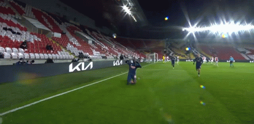 Soccer Game in Empty Stadium With Kia Banner