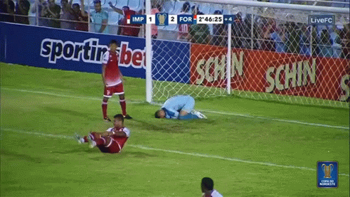 Soccer Game in Front of Betting Banner