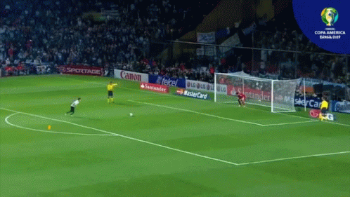 Soccer Game in Front of Canon Banner