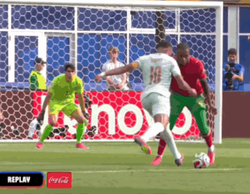 Soccer Game in Front of Coca Cola Advertisement