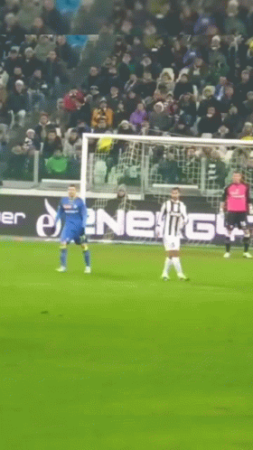 Soccer Game in Front of Energy Ad