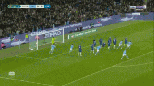 Soccer Game in Front of Etihad Banner