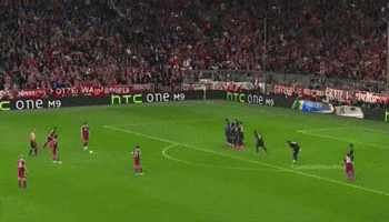 Soccer Game in Front of HTC Banner