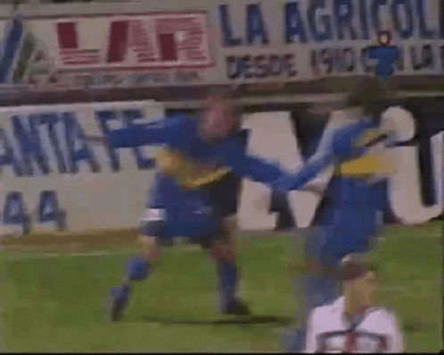 Soccer Game in Front of La Agricola Sign