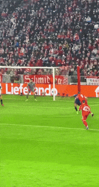 Soccer Game in Front of Lieferando Banner