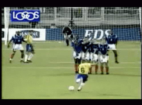 Soccer Game in Front of Logo Sign
