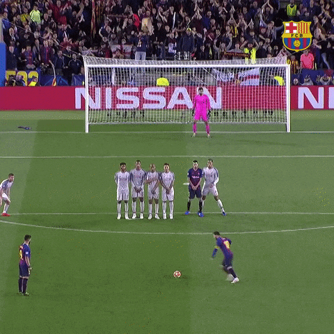 Soccer Game in Front of Nissan Sign