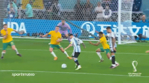 Soccer Game in Front of Waida Sign