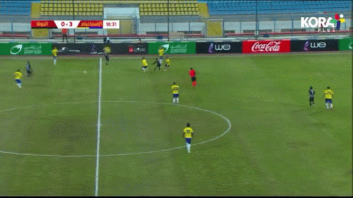 Soccer Game in Stadium With Coca Cola Ads