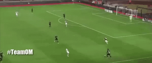 Soccer Game on Field With Obizza and Nike Ads