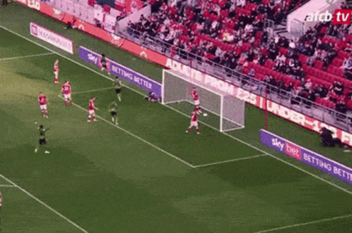 Soccer Game on Field with Sky Bet Banner