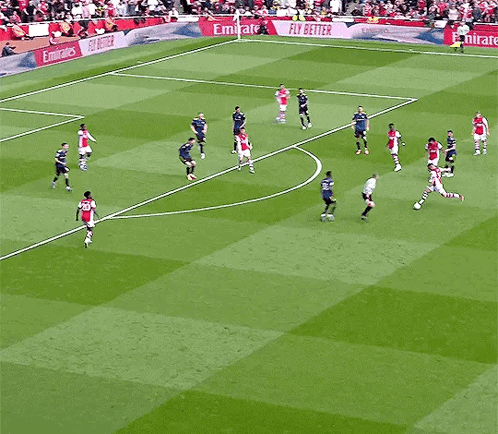 Soccer Game With Emirates Ads on Sidelines