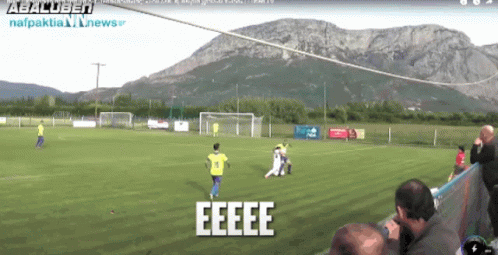 Soccer Game with Mountain in Background