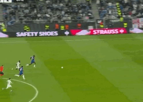 Soccer Game With Strauss Advertisement on Sidelines