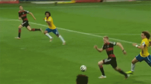 Soccer Goalie Jumping to Catch Ball With Yingli Solar Banner