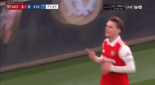 Soccer Man in Red White Jersey with Scoreboard