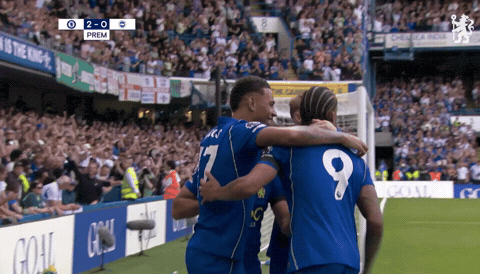 Soccer Player #9 Hugging Another Player