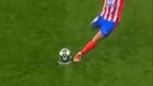 Soccer Player Airborne in Red White Blue Jersey