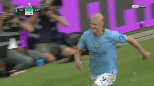 Soccer Player Celebrates Goal with Gatorade Banner