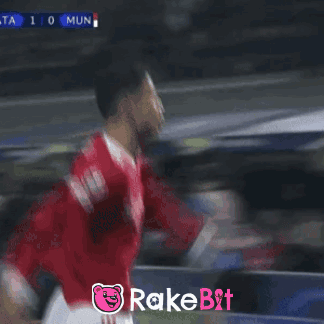 Soccer Player Celebrates Goal With Rakebit Logo