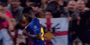 Soccer Player Celebrating Goal in Front of Fans