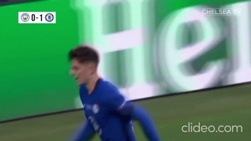 Soccer Player Celebrating Goal in Front of Heineken Ad