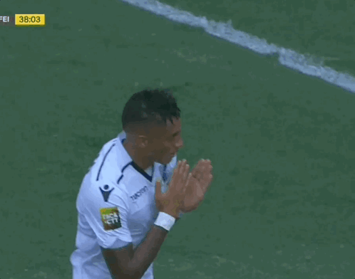 Soccer Player Celebrating Goal in Macron Jersey