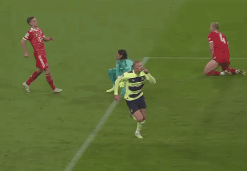 Soccer Player Celebrating Goal in Neon Yellow and Blue