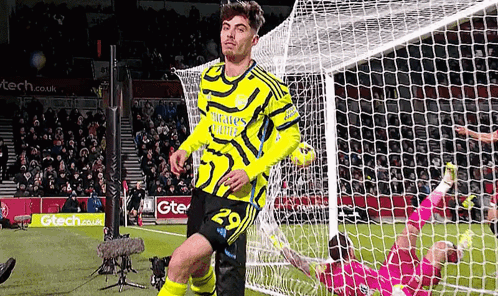 Soccer Player Celebrating Goal in Yellow Jersey