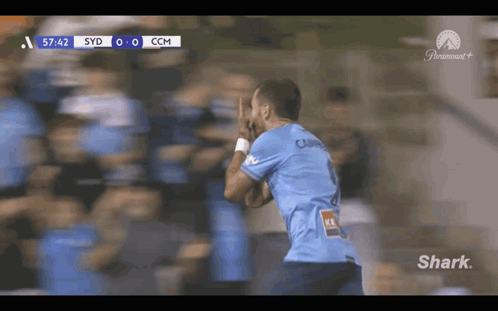 Soccer Player Celebrating Goal Sponsored by Shark
