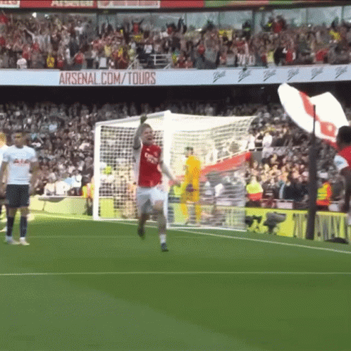 Soccer Player Celebrating Goal With Arsenal.com Tours Background GIF